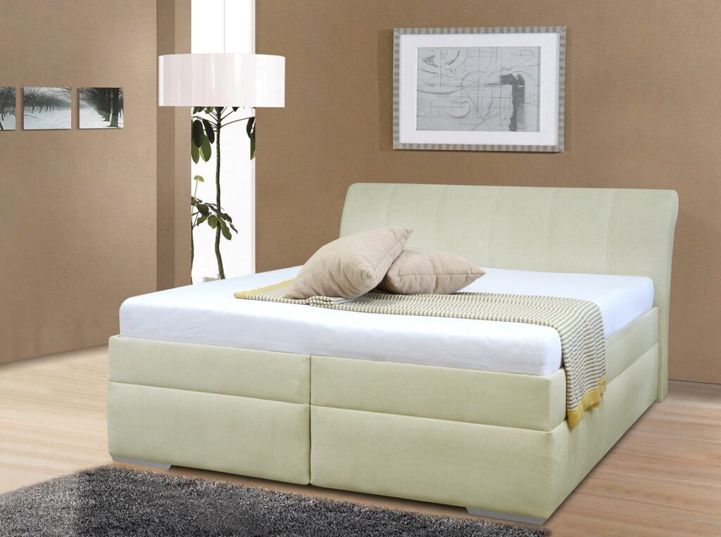 Impozantní postel se zvýšeným lůžkem. S úložným prostorem. S dřevěnýma nohama. Postel je určená pro